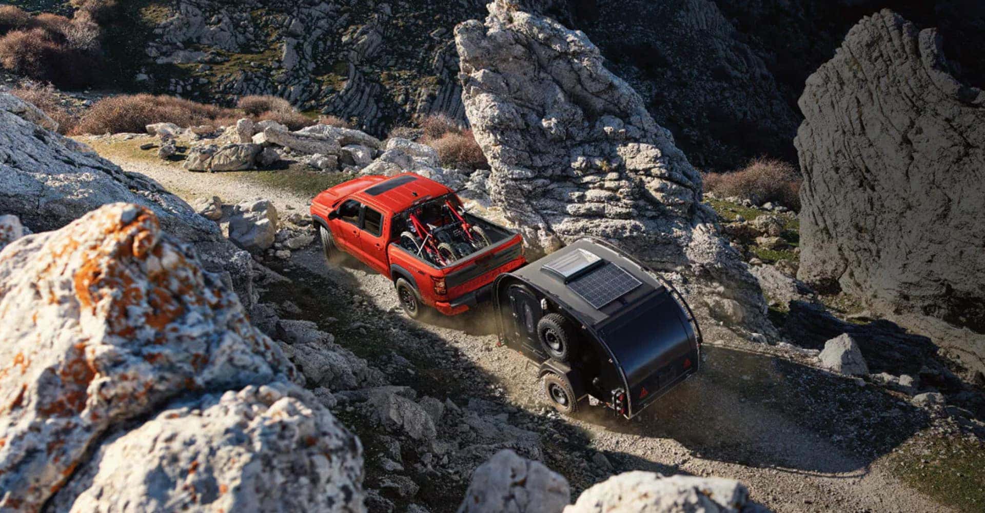 2026 Nissan Frontier hauling camper
