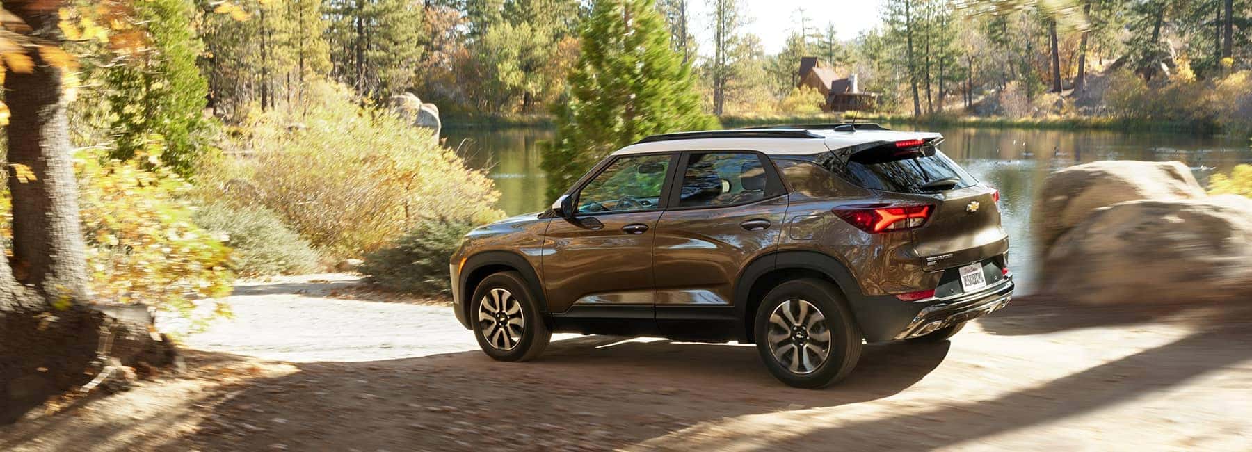 Brown 2021 Chevrolet Trailblazer Near a Forest Lake