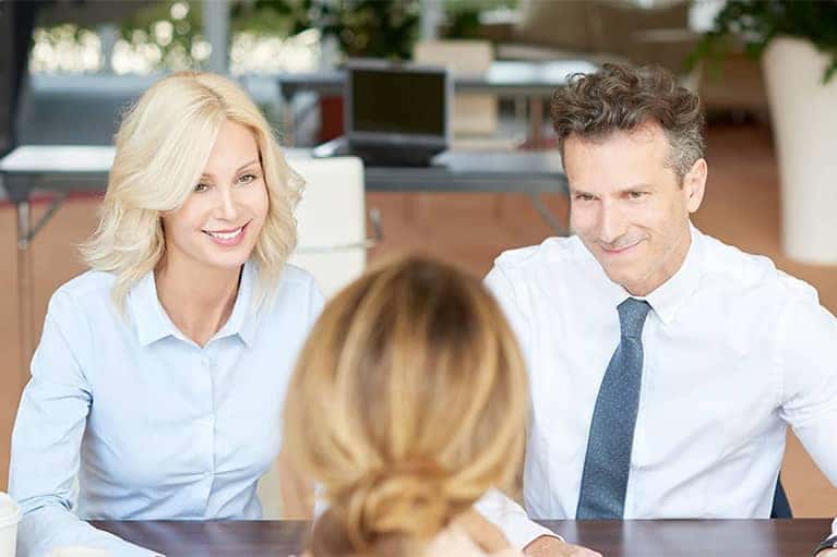 Man and Woman sitting in Finance Office