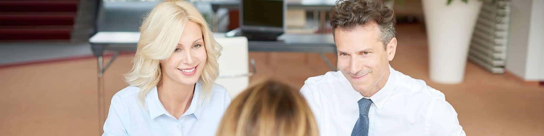Man and Woman sitting in Finance Office