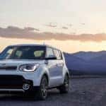 White 2019 Kia Soul parked near mountains at sunset