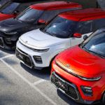 Numerous Kia Soul models all parked in a row in parking lot
