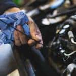 checking oil with dipstick