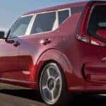 2020 red kia soul driving on highway