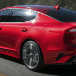 Red 2019 Kia Stinger Driving on Highway