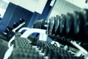 a set of dumbbells in a row